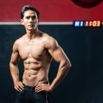 Man with gracilis muscle standing arms akimbo