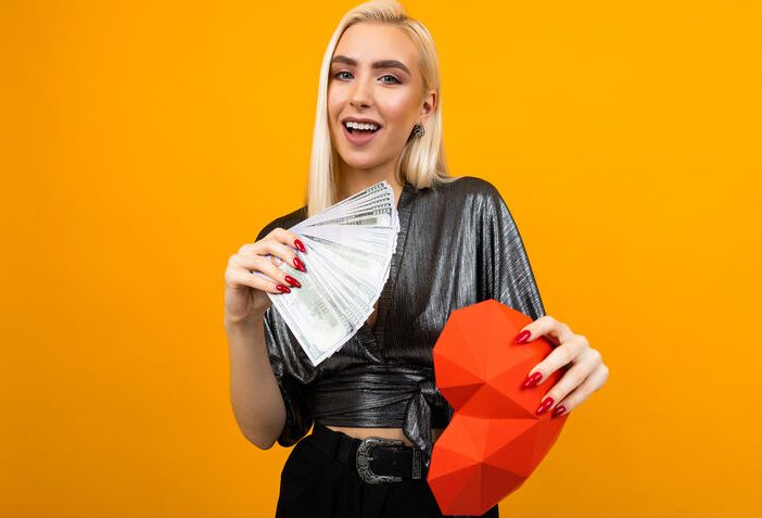 ring girl showing off her dollar bill