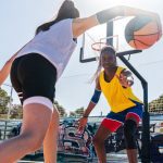 Female dribbling in basketbal game