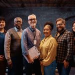Group of people with man in middle who received exercise science degree