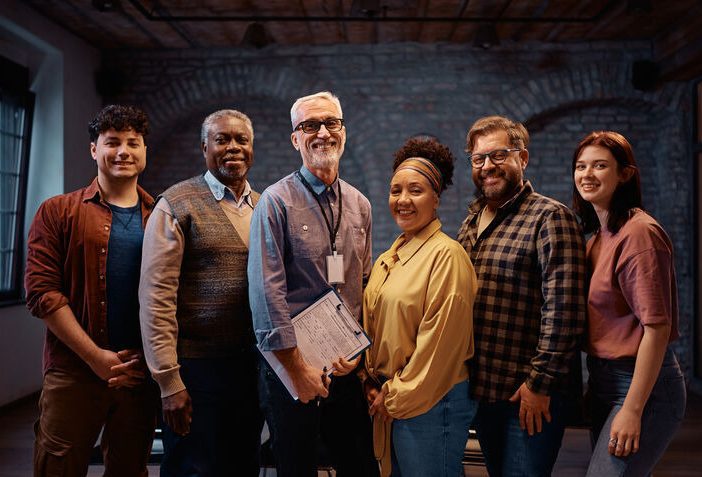 Group of people with man in middle who received exercise science degree