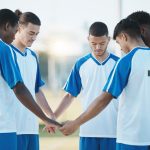 Male athletes reciting bible verses for athletes