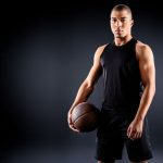 hybrid athlete holding a basketball