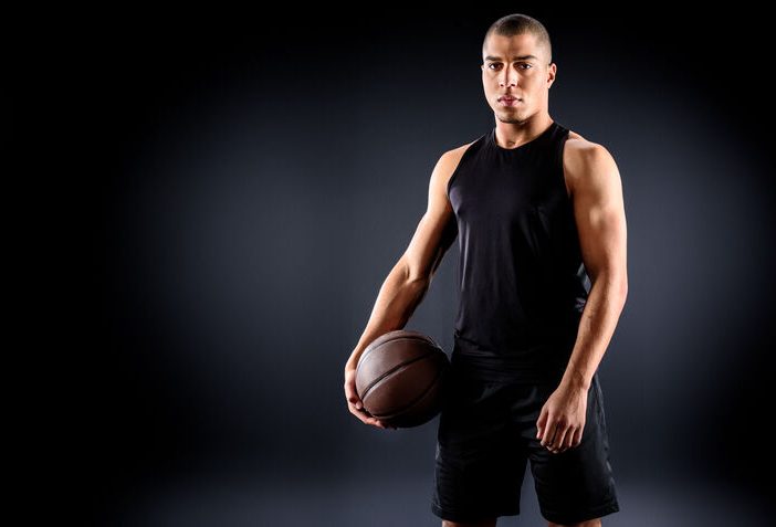 hybrid athlete holding a basketball